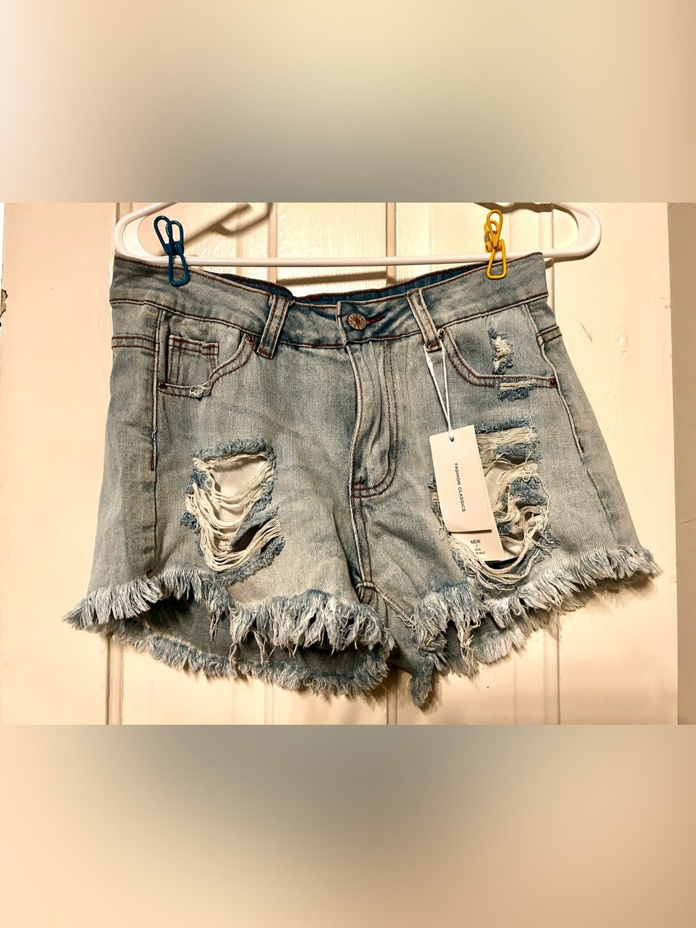 Distressed Light Blue Women's Denim Shorts with Frayed Hem